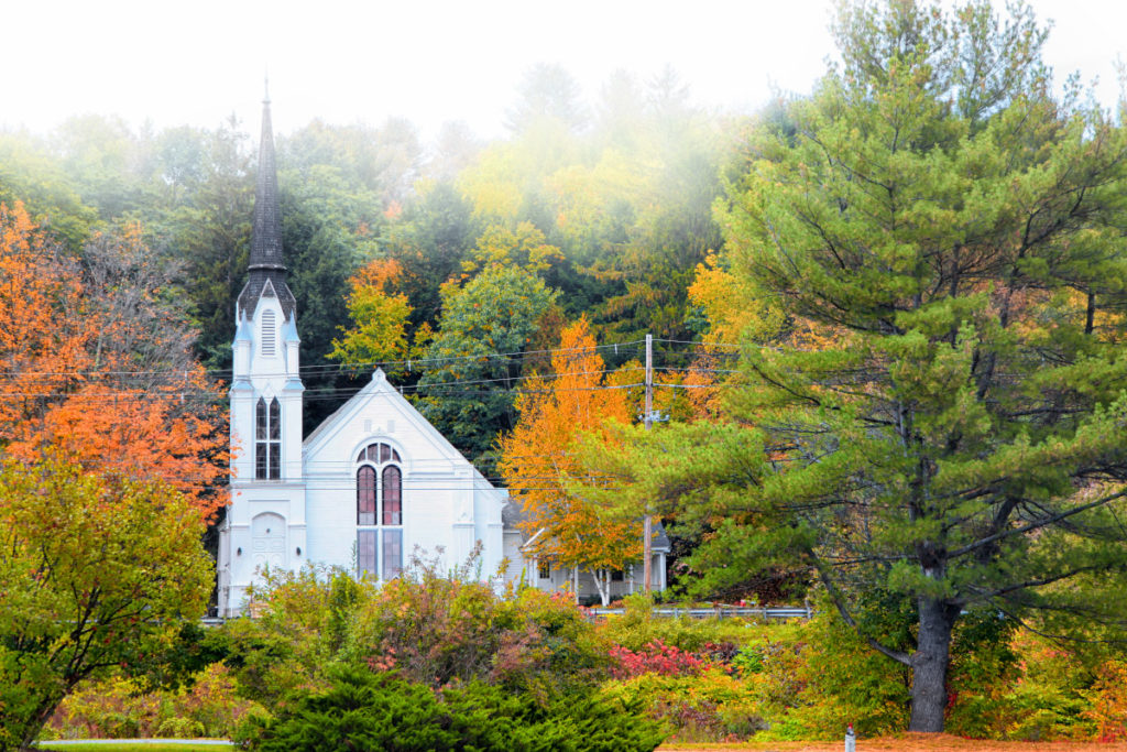 Simple fall decorating ideas with a photo of a church in Vermont in fall