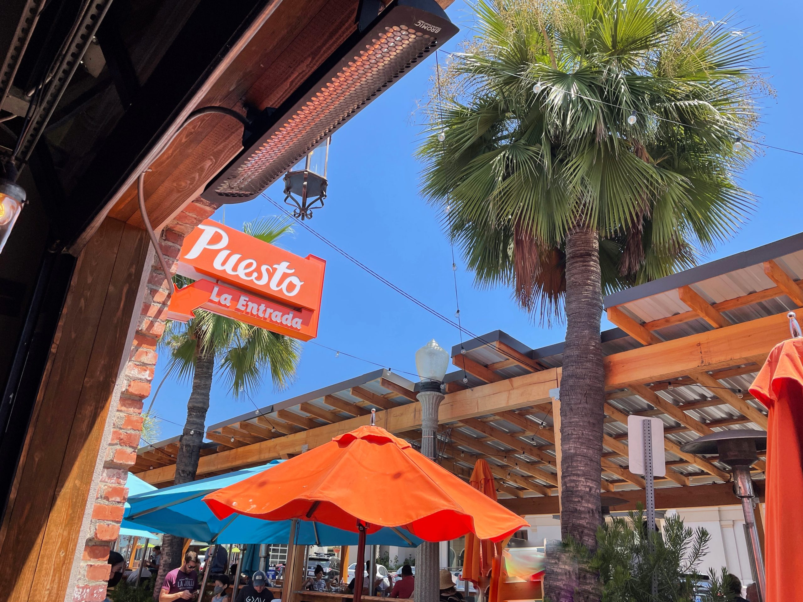Puesto San Diego Mexican restaurant la jolla location sign with palm tree