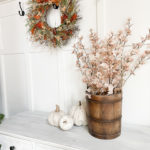 Simple and Neutral Fall Decor Ideas including wheat sheaths, gold accessories, faux pumpkins and apples, and faux fall foliage. Wall paint color is Sherwin Williams Accessible Beige