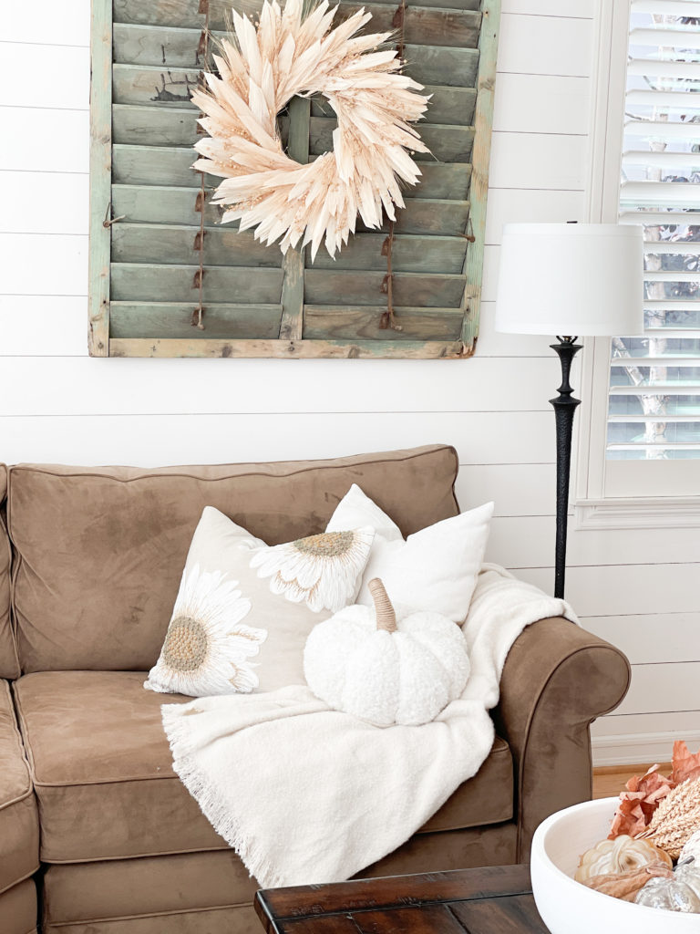 Simple and Neutral Fall Decor Ideas including wheat sheaths, gold accessories, faux pumpkins and apples, and faux fall foliage. Wall paint color is Sherwin Williams Accessible Beige