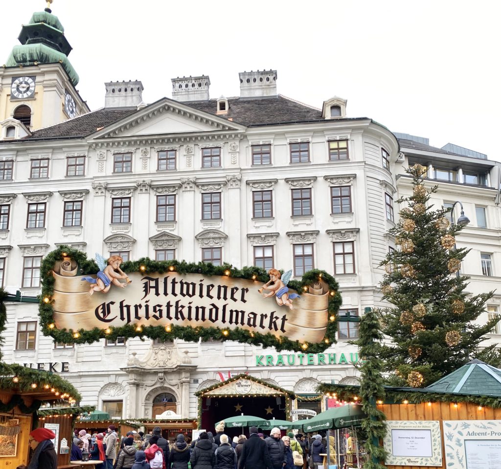 A Festive Travel Guide to Vienna at Christmas including where to stay in Vienna, where to eat in Vienna, and top things to do in Vienna.  You can also find a list of all the don't miss Vienna Christmas markets.  Our full itinerary included three days in Vienna with three days in Budapest, Hungary afterwards!  Photo is of a Christmas Market in Vienna.

#europeanchristmasmarkets #europeantravel #viennachristmasmarket #viennachristmas #christmasinvienna