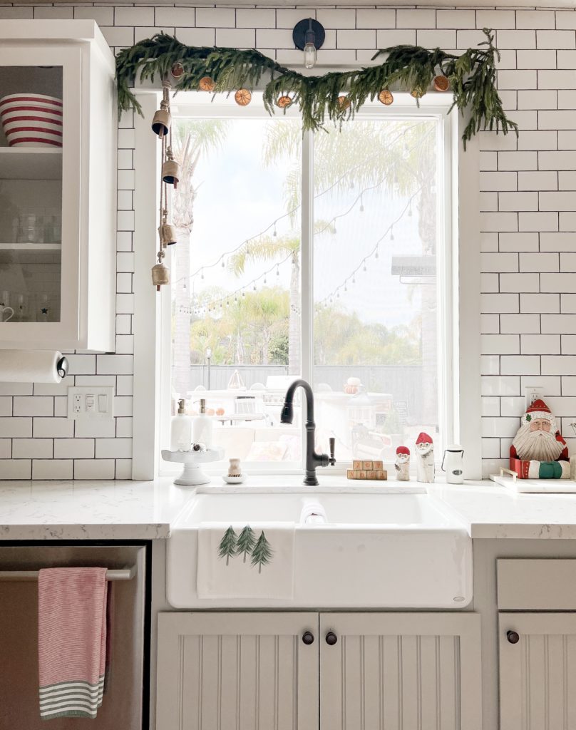 Simple Ways to Make your Kitchen Merry with holiday dish towels, soap bottles, orange slice garland, and festive island and table decor. 

#christmasdecor #christmaskitchen #christmasinspo