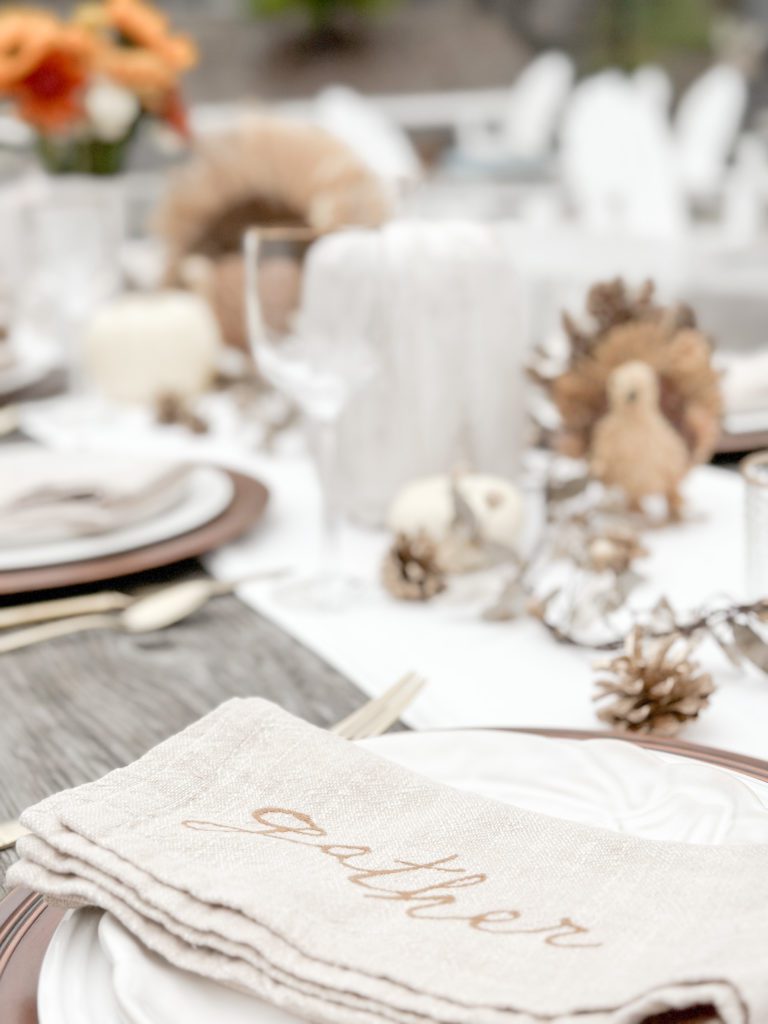 How to Set The Perfect Friendsgiving Table | How to set a Thanksgiving table | Items to use for a Friendsgiving or Thanksgiving dinner party | Thanksgiving table decor | Thanksgiving napkins | Thanksgiving centerpieces | Friendsgiving centerpieces | How to host a Friendsgiving dinner party | Urban Stems fall floral bouquets | Thankful napkins on pumpkin plates with copper chargers 