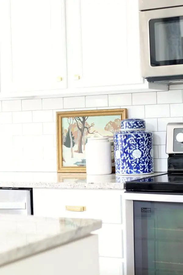 15 kitchen decorating posts you need to read | painting kitchen cabinets | open shelving in the kitchen | open shelves | how to decorate above the kitchen cabinets | how to style a kitchen hutch | how to decorate kitchen countertops | organize your pantry | update a 90's kitchen | a cottage kitchen | kitchen improvements | kitchen remodel ideas | kitchen inspiration 