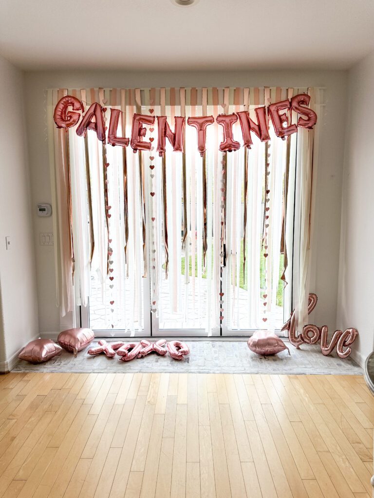 Tips for hosting a Galentine's Day favorite things party | What to do at a Galentine's Day party | What food to serve at a Galentine's Day party | How to decorate for a Galentine's Day party | A Galentines Day Party photo backdrop | Combining a Galentine's Day party with a favorite things party | How to host a Favorite things party | What is a Favorite things party | What is Galentines Day? 