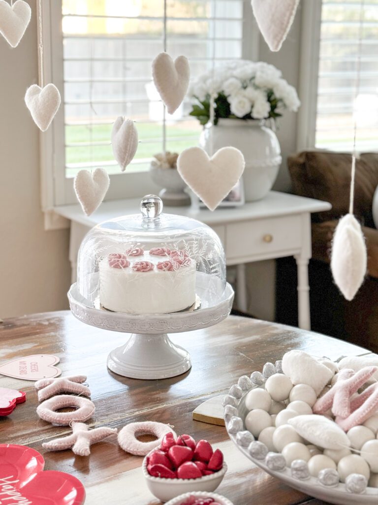 Tips for hosting a Galentine's Day favorite things party | What to do at a Galentine's Day party | What food to serve at a Galentine's Day party | How to decorate for a Galentine's Day party | A Galentines Day Party photo backdrop | Combining a Galentine's Day party with a favorite things party | How to host a Favorite things party | What is a Favorite things party | What is Galentines Day? 