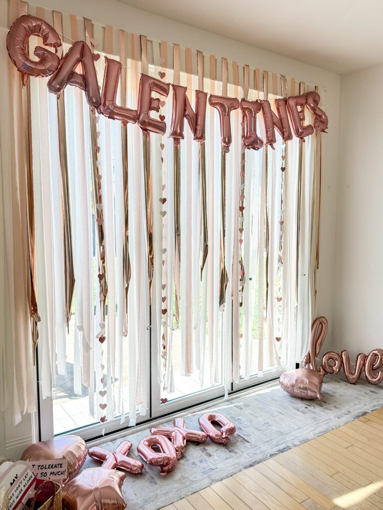 Tips for hosting a Galentine's Day favorite things party | What to do at a Galentine's Day party | What food to serve at a Galentine's Day party | How to decorate for a Galentine's Day party | A Galentines Day Party photo backdrop | Combining a Galentine's Day party with a favorite things party | How to host a Favorite things party | What is a Favorite things party | What is Galentines Day? 