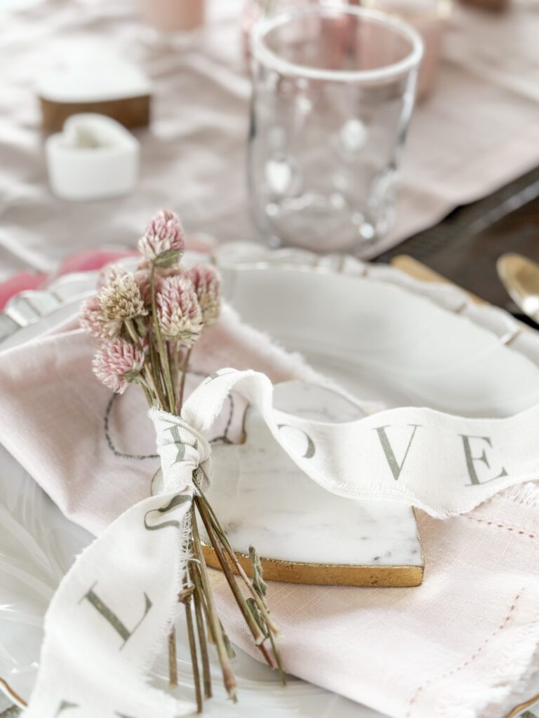 Tips for hosting a Galentine's Day favorite things party | What to do at a Galentine's Day party | What food to serve at a Galentine's Day party | How to decorate for a Galentine's Day party | A Galentines Day Party photo backdrop | Combining a Galentine's Day party with a favorite things party | How to host a Favorite things party | What is a Favorite things party | What is Galentines Day? 