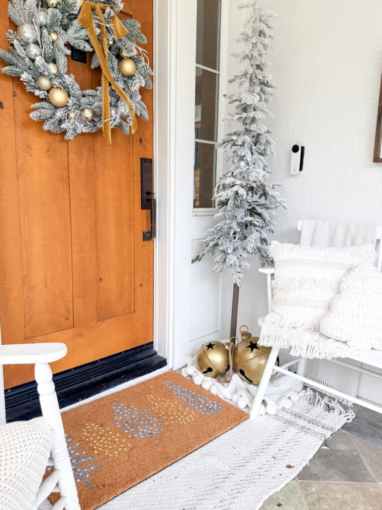 A stylish and classic Christmas home tour | How to decorate your home for the holidays using some sparkly decor plus traditional red decor in some spaces | Silver and gold Christmas decor | Red plaid bedroom decor | How to decorate your front porch for Christmas