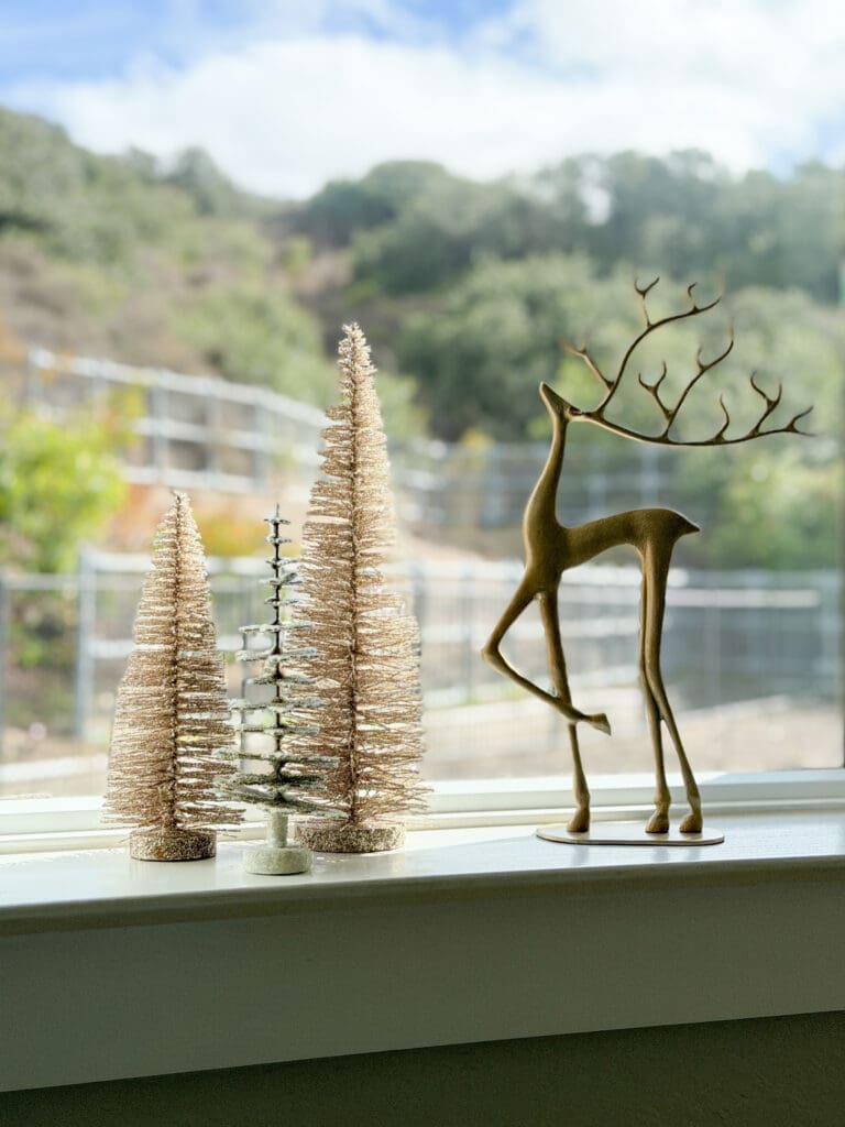 A stylish and classic Christmas home tour | How to decorate your home for the holidays using some sparkly decor plus traditional red decor in some spaces | Silver and gold Christmas decor | Red plaid bedroom decor | How to decorate your kitchen for Christmas | What to do with your European Christmas market mugs