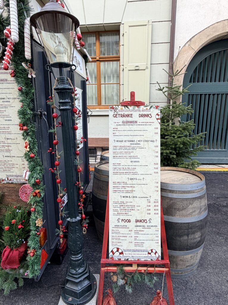 Basel Switzerland at Christmas TIme - A Complete Guide | Why I will always take a European Christmas Market trip every year | Top European Christmas Market to avoid massive crowds | Best Christmas Markets in Switzerland | Reasons to book a Flytographer photo shoot in Europe at Christmas time | Best five star hotels in Basel Switzerland | Top things to see and do in Basel at Christmas time | What to wear to the Basel Christmas market | How many days to spend in Basel for Christmas market trip | Where to find the Magical Christmas Courtyards in Basel 