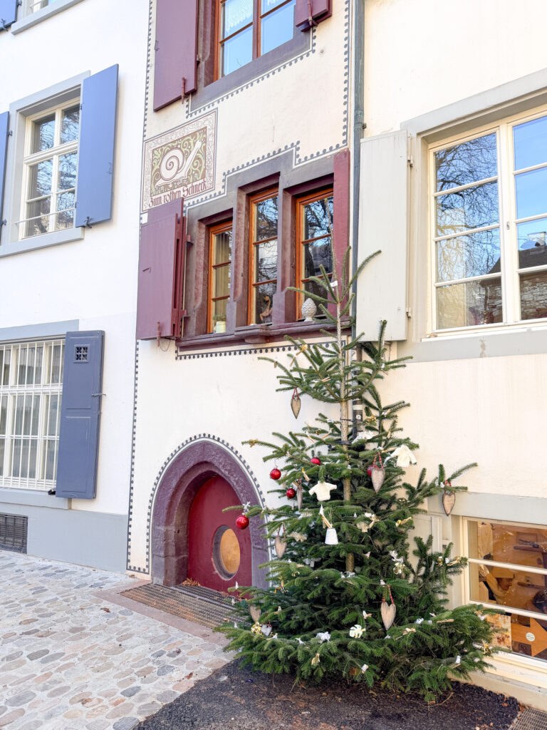 Basel Switzerland at Christmas TIme - A Complete Guide | Why I will always take a European Christmas Market trip every year | Top European Christmas Market to avoid massive crowds | Best Christmas Markets in Switzerland | Reasons to book a Flytographer photo shoot in Europe at Christmas time | Best five star hotels in Basel Switzerland | Top things to see and do in Basel at Christmas time | What to wear to the Basel Christmas market | How many days to spend in Basel for Christmas market trip | Where to find the Magical Christmas Courtyards in Basel 