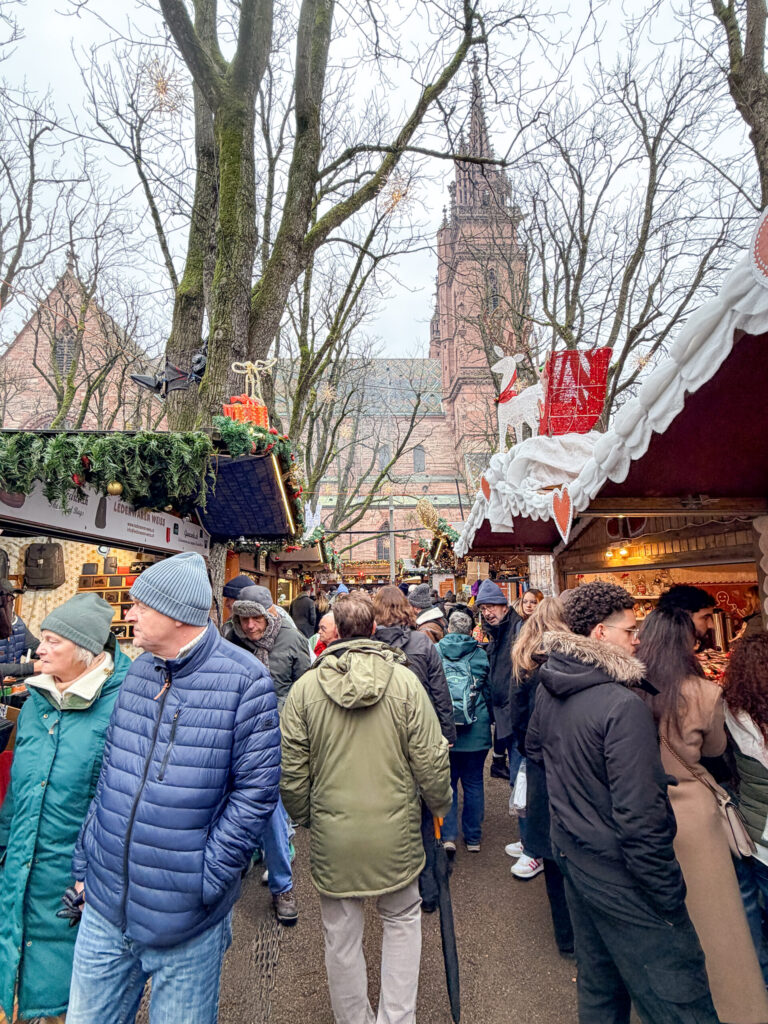 Basel Switzerland at Christmas TIme - A Complete Guide | Why I will always take a European Christmas Market trip every year | Top European Christmas Market to avoid massive crowds | Best Christmas Markets in Switzerland | Reasons to book a Flytographer photo shoot in Europe at Christmas time | Best five star hotels in Basel Switzerland | Top things to see and do in Basel at Christmas time | What to wear to the Basel Christmas market | How many days to spend in Basel for Christmas market trip | Where to find the Magical Christmas Courtyards in Basel | Visiting Basel Minster and what you need to know before climbing the tower | Visiting the Christmas Market in Basel 