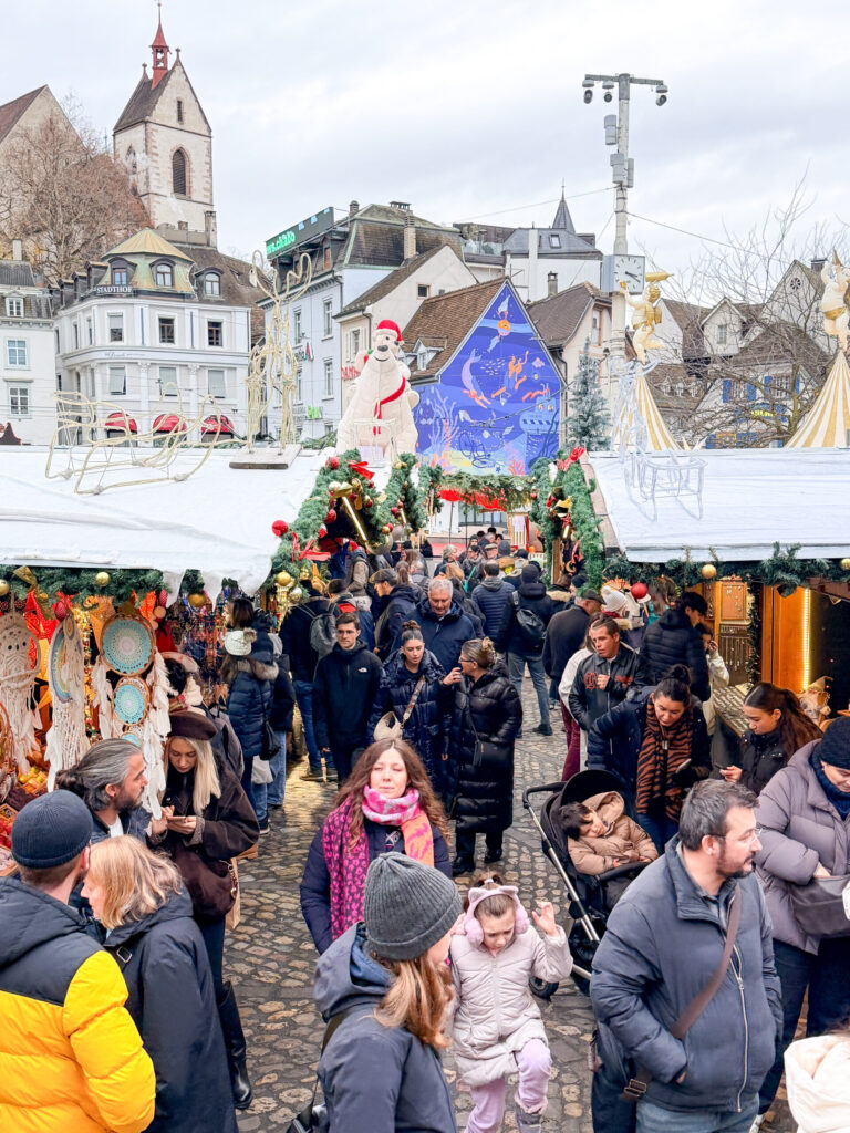 Basel Switzerland at Christmas TIme - A Complete Guide | Why I will always take a European Christmas Market trip every year | Top European Christmas Market to avoid massive crowds | Best Christmas Markets in Switzerland | Reasons to book a Flytographer photo shoot in Europe at Christmas time | Best five star hotels in Basel Switzerland | Top things to see and do in Basel at Christmas time | What to wear to the Basel Christmas market | How many days to spend in Basel for Christmas market trip | Where to find the Magical Christmas Courtyards in Basel | Visiting Basel Minster and what you need to know before climbing the tower | Visiting the Christmas Market in Basel 