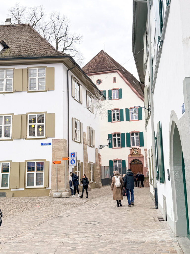 Basel Switzerland at Christmas TIme - A Complete Guide | Why I will always take a European Christmas Market trip every year | Top European Christmas Market to avoid massive crowds | Best Christmas Markets in Switzerland | Reasons to book a Flytographer photo shoot in Europe at Christmas time | Best five star hotels in Basel Switzerland | Top things to see and do in Basel at Christmas time | What to wear to the Basel Christmas market | How many days to spend in Basel for Christmas market trip | Where to find the Magical Christmas Courtyards in Basel | Visiting Basel Minster and what you need to know before climbing the tower 