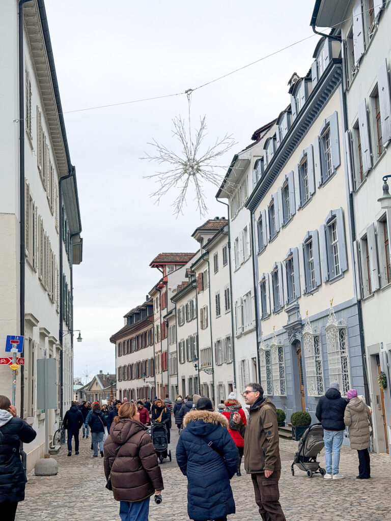 Basel Switzerland at Christmas TIme - A Complete Guide | Why I will always take a European Christmas Market trip every year | Top European Christmas Market to avoid massive crowds | Best Christmas Markets in Switzerland | Reasons to book a Flytographer photo shoot in Europe at Christmas time | Best five star hotels in Basel Switzerland | Top things to see and do in Basel at Christmas time | What to wear to the Basel Christmas market | How many days to spend in Basel for Christmas market trip | Where to find the Magical Christmas Courtyards in Basel | Visiting Basel Minster and what you need to know before climbing the tower | Visiting the Christmas Market in Basel | Reviews of Grand Hotel Les Trois Rois in Basel 