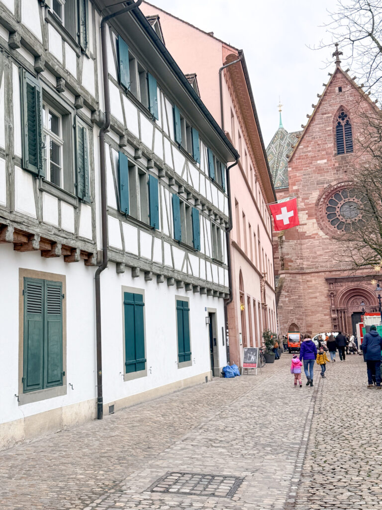 Basel Switzerland at Christmas TIme - A Complete Guide | Why I will always take a European Christmas Market trip every year | Top European Christmas Market to avoid massive crowds | Best Christmas Markets in Switzerland | Reasons to book a Flytographer photo shoot in Europe at Christmas time | Best five star hotels in Basel Switzerland | Top things to see and do in Basel at Christmas time | What to wear to the Basel Christmas market | How many days to spend in Basel for Christmas market trip | Where to find the Magical Christmas Courtyards in Basel | Visiting Basel Minster and what you need to know before climbing the tower 