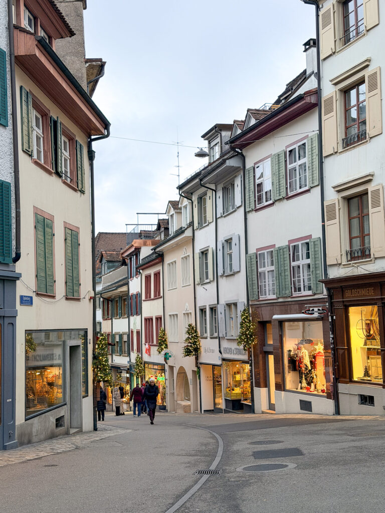 Basel Switzerland at Christmas TIme - A Complete Guide | Why I will always take a European Christmas Market trip every year | Top European Christmas Market to avoid massive crowds | Best Christmas Markets in Switzerland | Reasons to book a Flytographer photo shoot in Europe at Christmas time | Best five star hotels in Basel Switzerland | Top things to see and do in Basel at Christmas time | What to wear to the Basel Christmas market | How many days to spend in Basel for Christmas market trip | Where to find the Magical Christmas Courtyards in Basel 