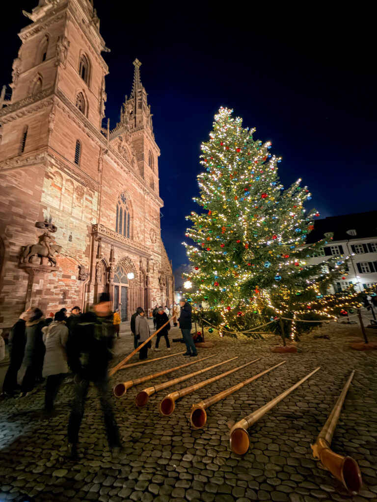 Basel Switzerland at Christmas TIme - A Complete Guide | Why I will always take a European Christmas Market trip every year | Top European Christmas Market to avoid massive crowds | Best Christmas Markets in Switzerland | Reasons to book a Flytographer photo shoot in Europe at Christmas time | Best five star hotels in Basel Switzerland | Top things to see and do in Basel at Christmas time | What to wear to the Basel Christmas market | How many days to spend in Basel for Christmas market trip | Where to find the Magical Christmas Courtyards in Basel | Visiting Basel Minster and what you need to know before climbing the tower 