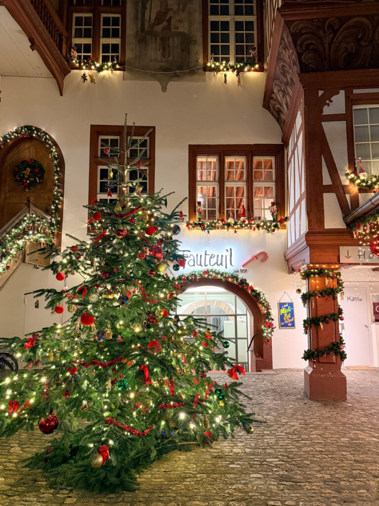 Basel Switzerland at Christmas TIme - A Complete Guide | Why I will always take a European Christmas Market trip every year | Top European Christmas Market to avoid massive crowds | Best Christmas Markets in Switzerland | Reasons to book a Flytographer photo shoot in Europe at Christmas time | Best five star hotels in Basel Switzerland | Top things to see and do in Basel at Christmas time | What to wear to the Basel Christmas market | How many days to spend in Basel for Christmas market trip | Where to find the Magical Christmas Courtyards in Basel 