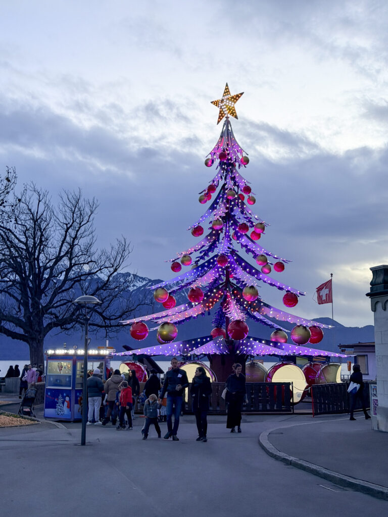 A Montreux Switzerland Christmas Market guide | An honest opinion about the Montreux Christmas market and if it deserves to be considered one of the best in Europe | Where to stay to visit the Montreux Christmas Market | Things to see near Montreux in December | what to do in the Swiss Riviera in December | How many days to spend at the Montreux Christmas market | Chateau Chillon at Christmas time | Visiting Rochers de Naye from Montreux | A day trip to Vevey | How much time to spend at Chaplins World | Is Chaplins World worth visiting | A quick stop in Gruyeres | what to do in Gruyeres | What to do in Vevey | The best luxury hotels near Montreux | The best five star hotels in Montreux | The most luxurious 5 star hotels in the Swiss Riviera | Montreal Jazz festival | What Queen things are there to see in Montreux | Freddie Mercury and Queen in Montreux 