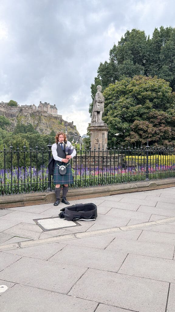 How to spend two days in Edinburgh Scotland | Best things to see and do in Edinburgh Scotland | Tips for visiting Old Town Edinburgh Scotland  | Top things to see in Edinburgh | Edinburgh tips | Edinburgh Scotland crowds | Princes Street and Scott Monument and bagpipers busking 